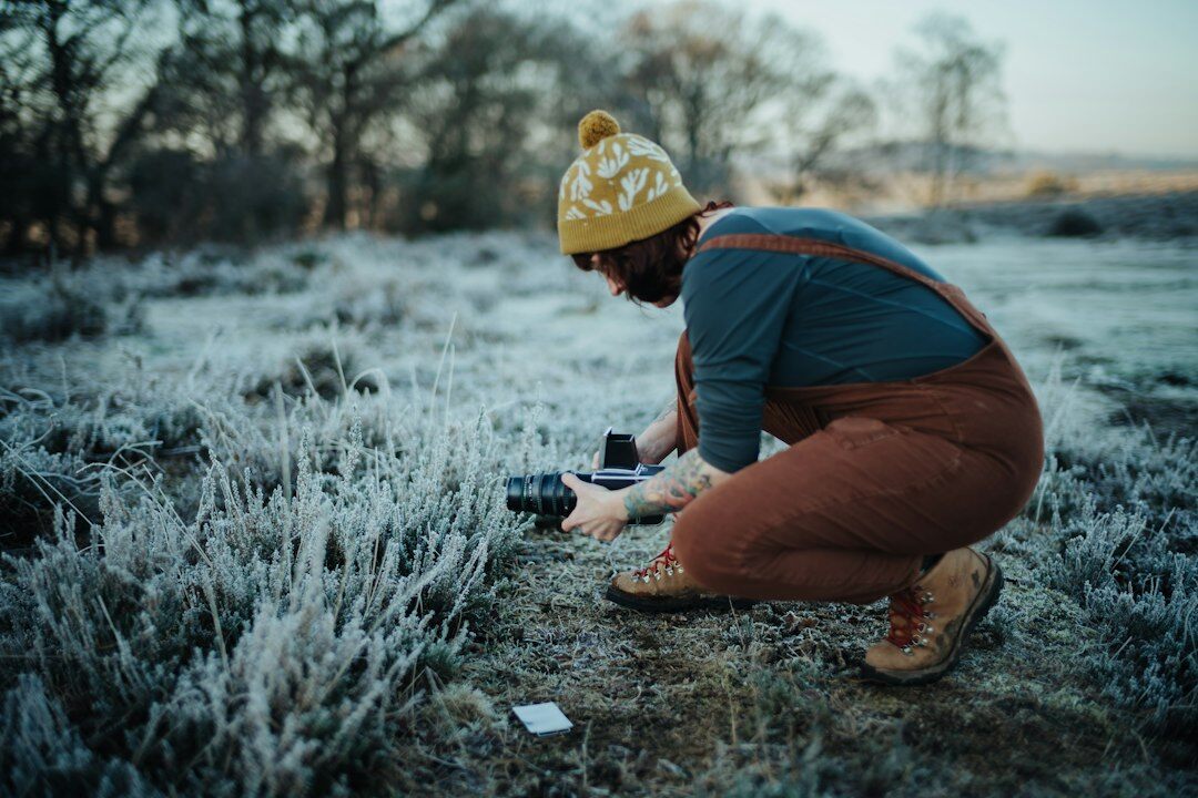 Documentary photographer taking notes in the field
